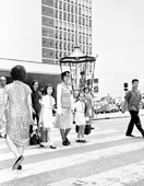 A woman police on duty at Chater Road, 1964