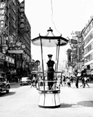 A policeman on traffic duty in Nathan Road near Shantung Street, 1962