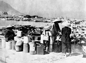 Boat people queuing up for water from a public standpipe, 1953