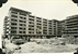 Block E at Lo Fu Ngam contains staff quarters on the top floor and 70 self-contained flats on the other five upper floors. The ground floor is for shops, September 1957.