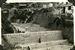 A dam built to prevent hundreds of tons of silt from being washed down into the main city nullahs in Ho Man Tin Resettlement Area, 1956. 