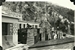 Settlers demolishing their squatter huts before moving into the adjacent stone cottages built by the Church World Service in Chuk Yuen, November 1957.